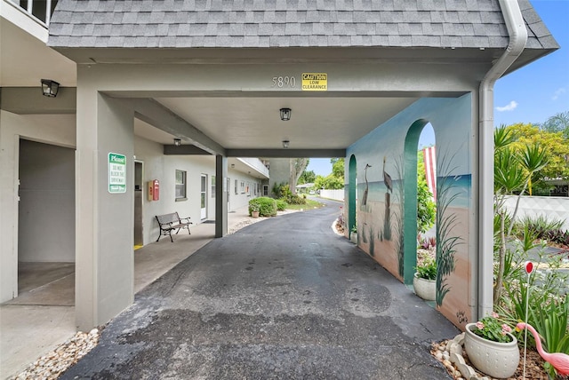 exterior space with a carport