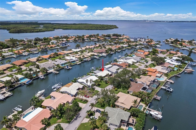 drone / aerial view with a water view and a residential view