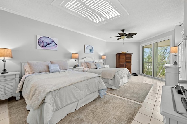 bedroom with ceiling fan, light tile patterned floors, a textured ceiling, and ornamental molding