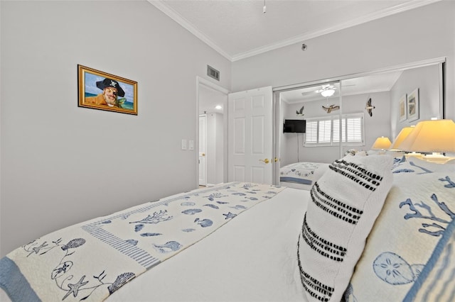 bedroom with ornamental molding and a closet