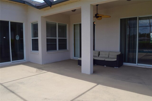 view of patio / terrace featuring ceiling fan and an outdoor living space