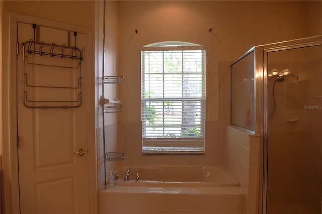 bathroom featuring plus walk in shower