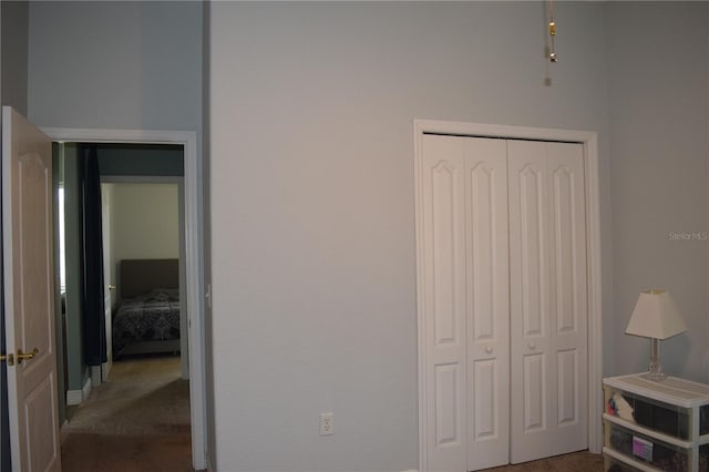 bedroom with carpet flooring and a closet