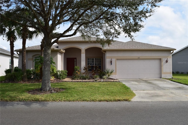 ranch-style house with a front lawn and a garage