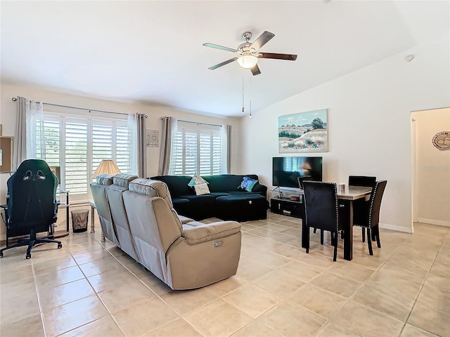 tiled living room with ceiling fan and lofted ceiling