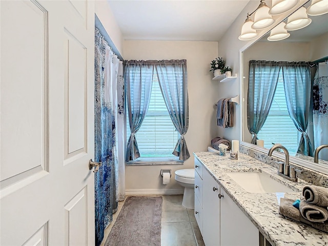 11247 Corey Pavin Ln, San Antonio, FL 33576 - bathroom featuring toilet, tile patterned floors, baseboards, and vanity