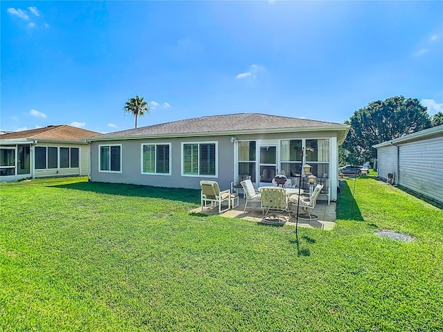 11247 Corey Pavin Ln, San Antonio, FL 33576 - back of house with a yard, stucco siding, a sunroom, and a patio