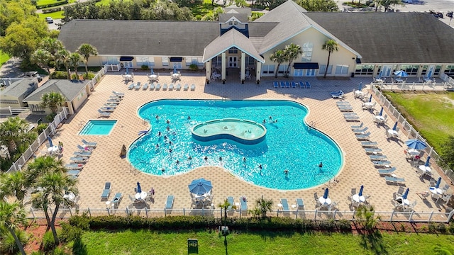 11247 Corey Pavin Ln, San Antonio, FL 33576 - community pool with a community hot tub, a patio area, and fence
