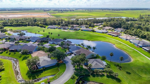 11247 Corey Pavin Ln, San Antonio, FL 33576 - bird's eye view featuring golf course view, a water view, and a residential view