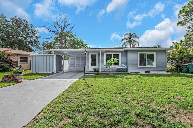 view of front of property featuring a carport and a front lawn