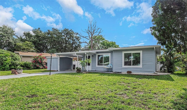 ranch-style house with a carport and a front lawn