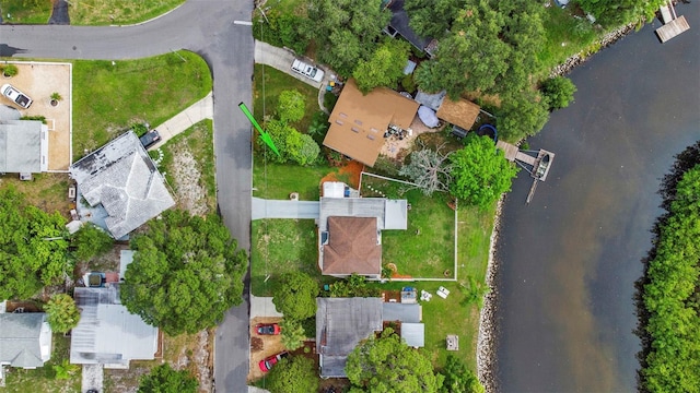 birds eye view of property with a water view