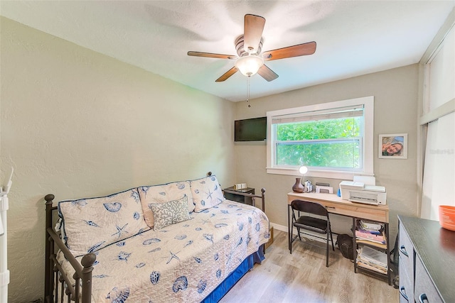 bedroom featuring ceiling fan and light hardwood / wood-style flooring