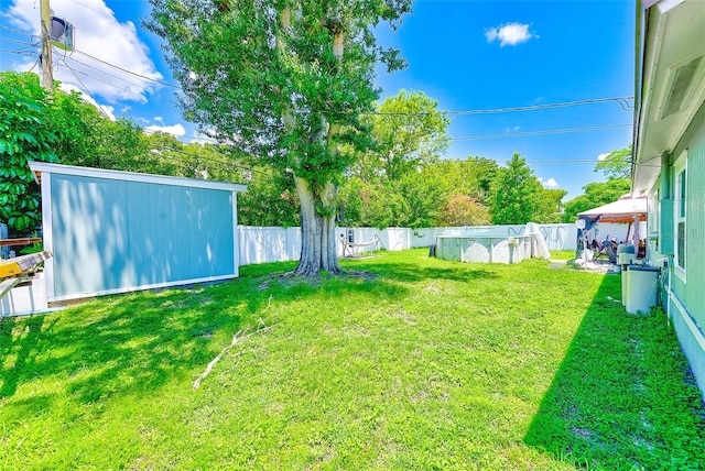 view of yard with a gazebo and a fenced in pool