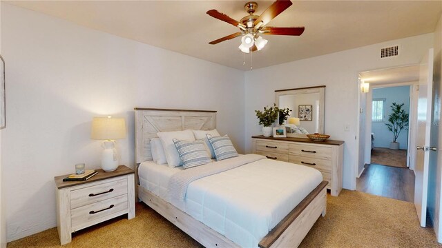 carpeted bedroom featuring ceiling fan