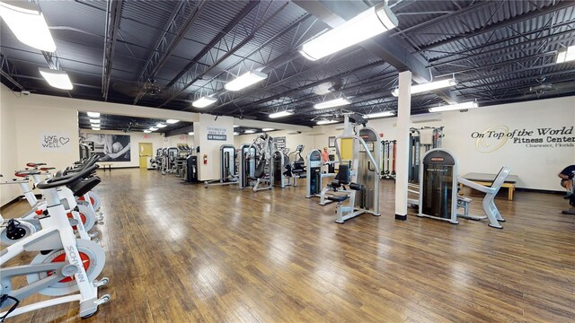 gym with wood-type flooring