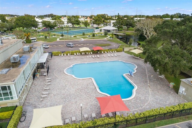 view of pool with a wall mounted air conditioner