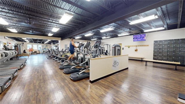 workout area with hardwood / wood-style floors