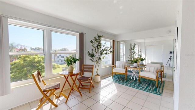 living area featuring light tile patterned floors and a wealth of natural light