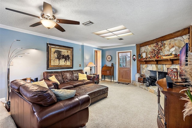 living room featuring carpet, a fireplace, ceiling fan, crown molding, and a textured ceiling