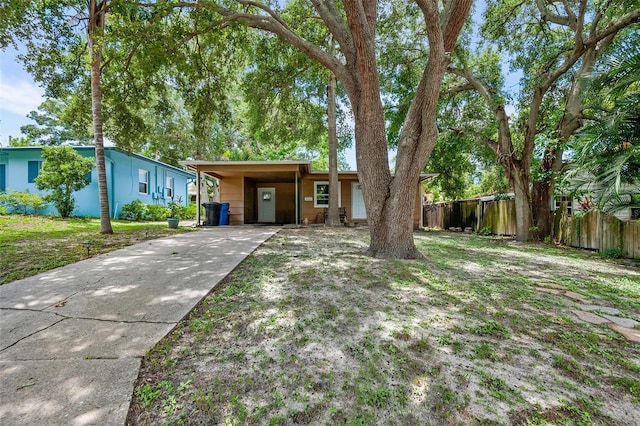 ranch-style house featuring a carport