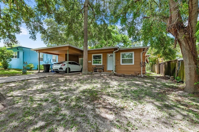 single story home featuring a carport