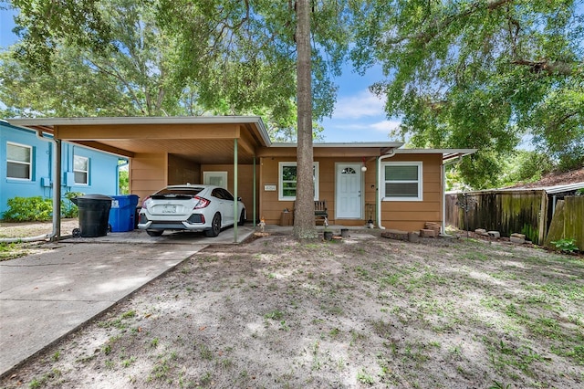 view of front of home with a carport