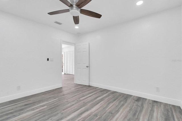 empty room featuring ceiling fan and light wood-type flooring