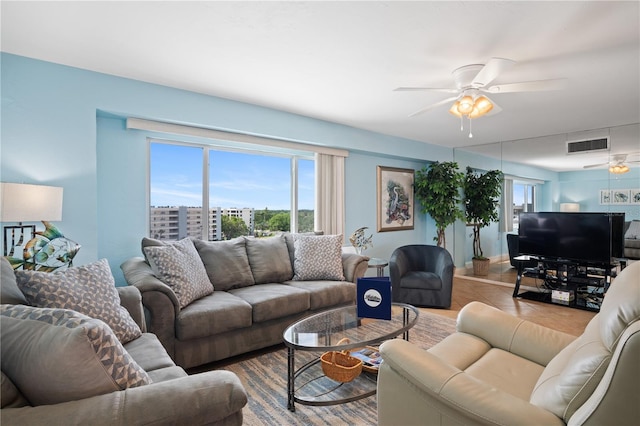 living room featuring ceiling fan