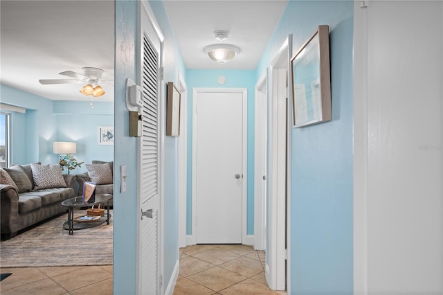 hallway featuring light tile patterned floors