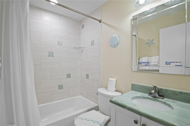 full bathroom featuring vanity, shower / tub combo with curtain, and toilet