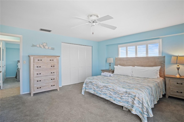 bedroom featuring ceiling fan, a closet, and carpet