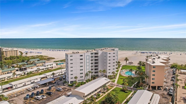 bird's eye view featuring a view of the beach and a water view