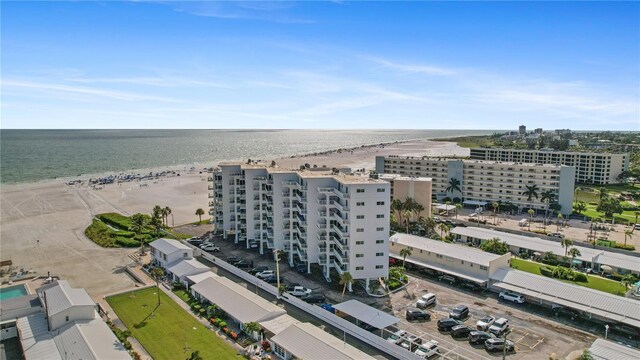 bird's eye view with a beach view and a water view