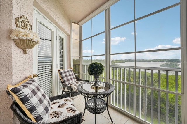 sunroom with a water view