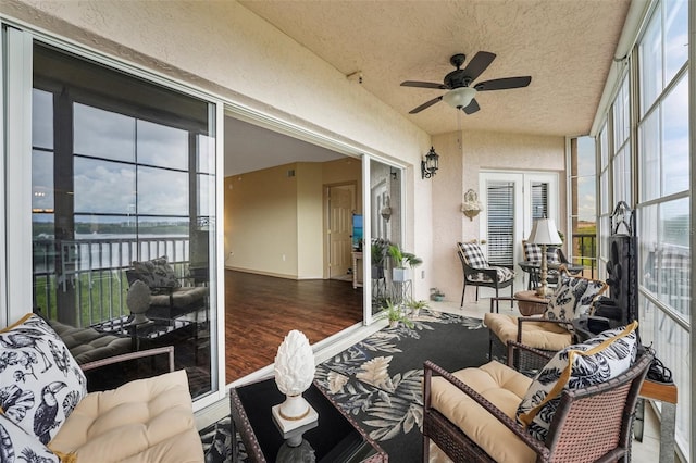 sunroom with ceiling fan and french doors