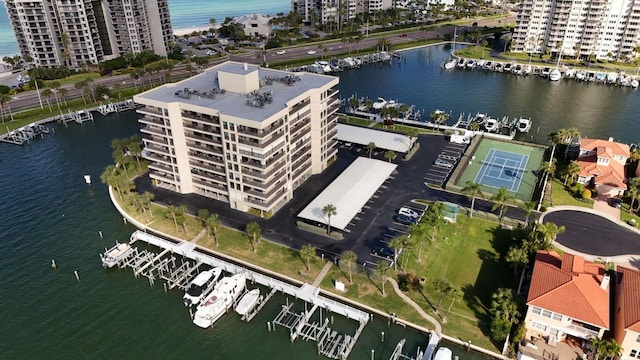 birds eye view of property featuring a city view and a water view