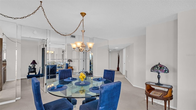 dining space featuring a textured ceiling and a chandelier