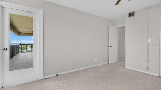 unfurnished bedroom with ceiling fan and light carpet