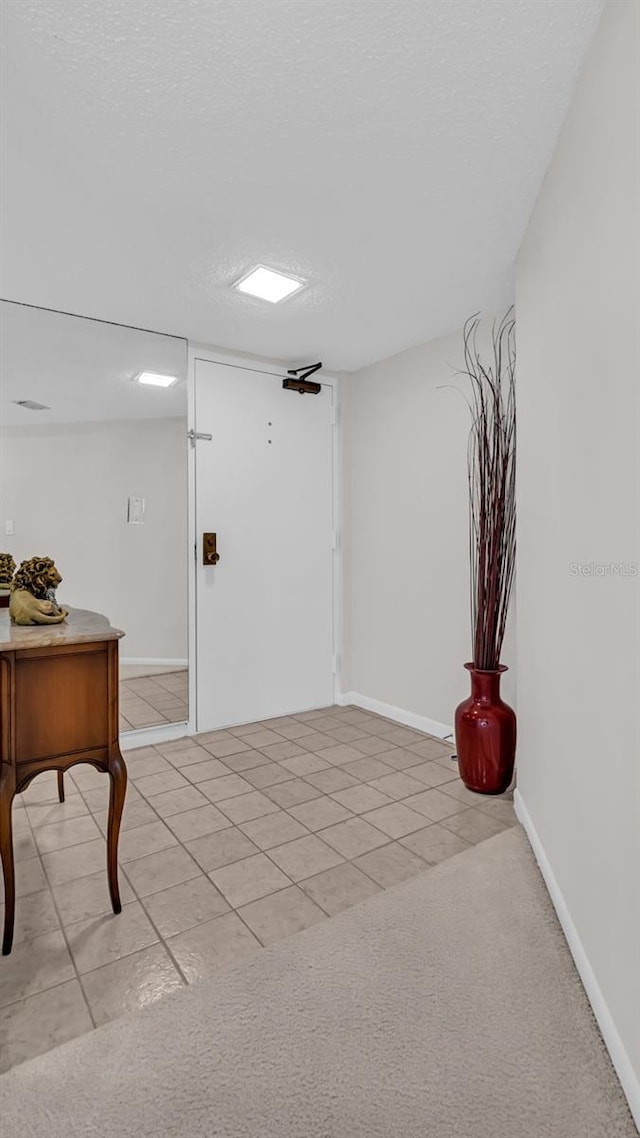 interior space featuring a textured ceiling