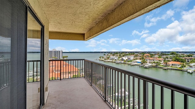 balcony featuring a water view