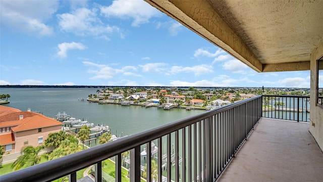 balcony featuring a water view