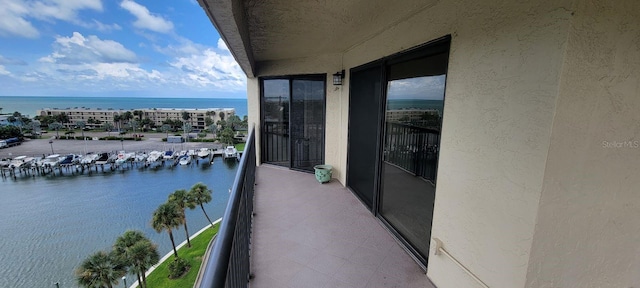 balcony featuring a water view