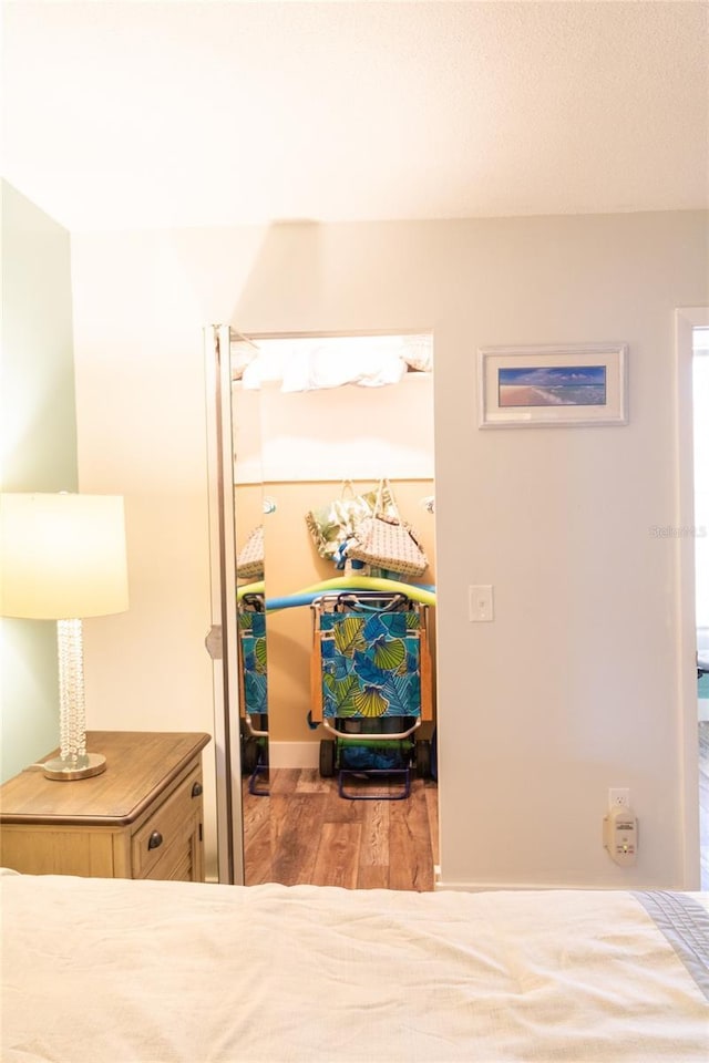 bedroom with wood finished floors