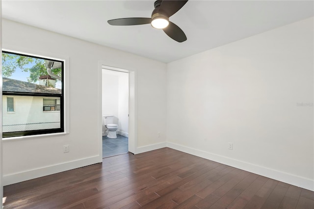 unfurnished room featuring ceiling fan and dark hardwood / wood-style flooring