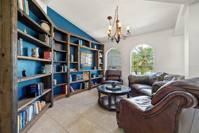 sitting room with tile patterned flooring, lofted ceiling, and an inviting chandelier