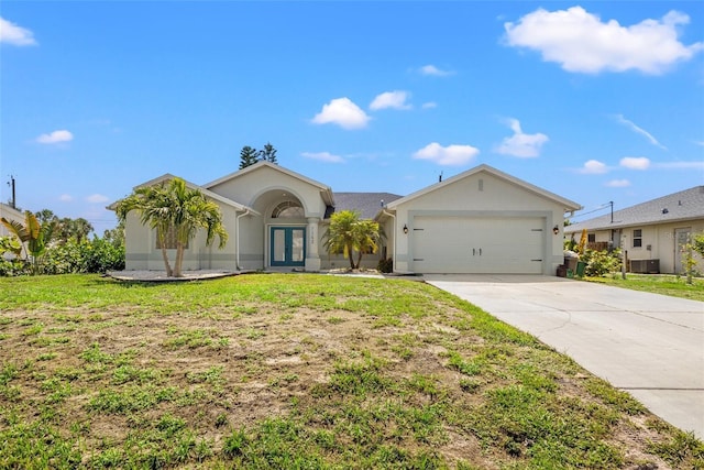 single story home featuring central AC, french doors, a front lawn, and a garage