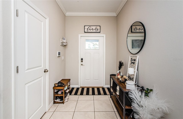 tiled entrance foyer with ornamental molding