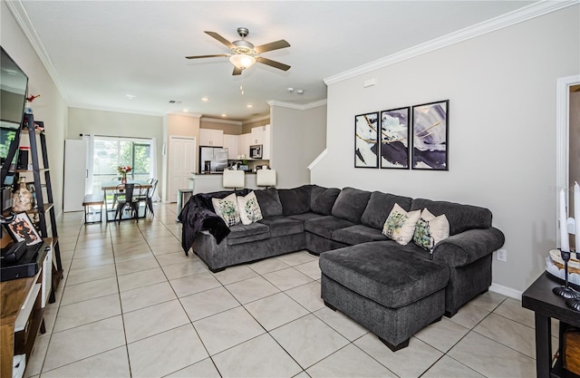 living room featuring ceiling fan, ornamental molding, and light tile patterned flooring