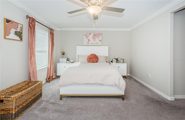 carpeted bedroom with ceiling fan and ornamental molding